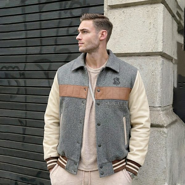 Front and back industrial 3D tech pack mockup of the SU-1012 Heritage Varsity Jacket showcasing the grey wool body, cream leather sleeves, tan chest stripe, and rear SURAFH INDUSTRY branding.