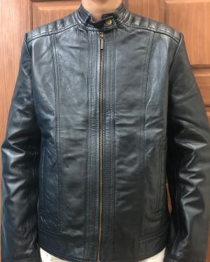 Front close-up view of a sample custom men's black leather cafe racer jacket displaying the snap-tab collar, horizontal quilted shoulder panels, and central metallic zipper.