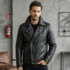 Front view of a sample custom men's double-breasted black leather jacket displaying a four-button crossover design, wide notch lapels, and a lower flap pocket.