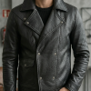 Macro shot of an OEM double-breasted leather jacket highlighting the grain pattern, symmetric snap buttons, and robust stitching along the lapels.