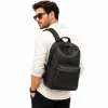 9 Man wearing black leather backpack on one shoulder, side view