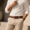Man wearing brown leather belt wholesale with chino pants, front view