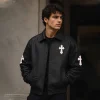 Model wearing black Cross Patch Leather Varsity Jacket - front view lifestyle shot