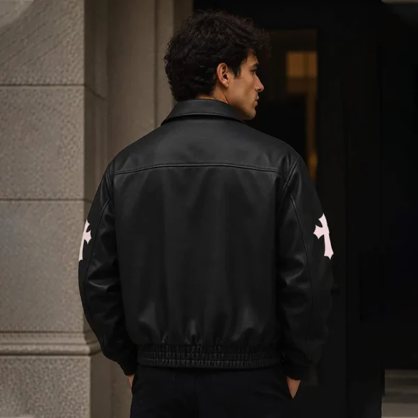 Model wearing black Cross Patch Leather Varsity Jacket - back view lifestyle shot