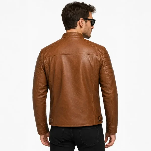 Lifestyle photo of model wearing cognac leather cafe racer jacket with zip pocket detail